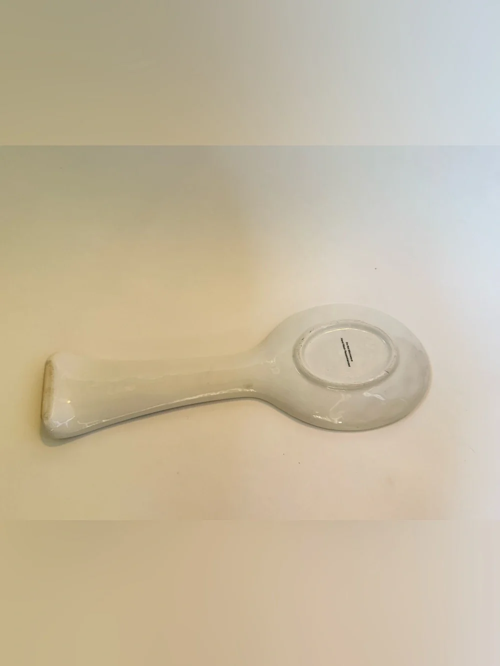 Decorative White Ceramic Spoon Rest with Red Floral Accents
